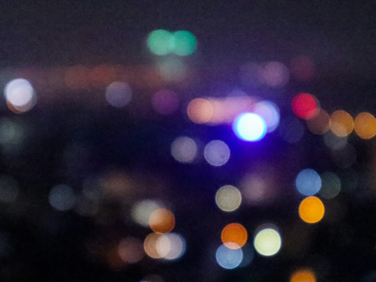 blurred city lights from the sky are showing off