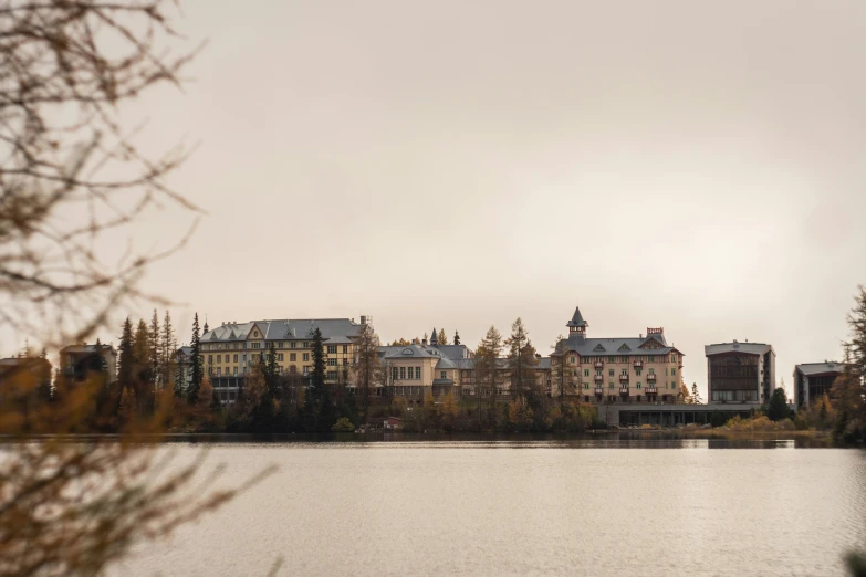 several houses and some trees over a body of water