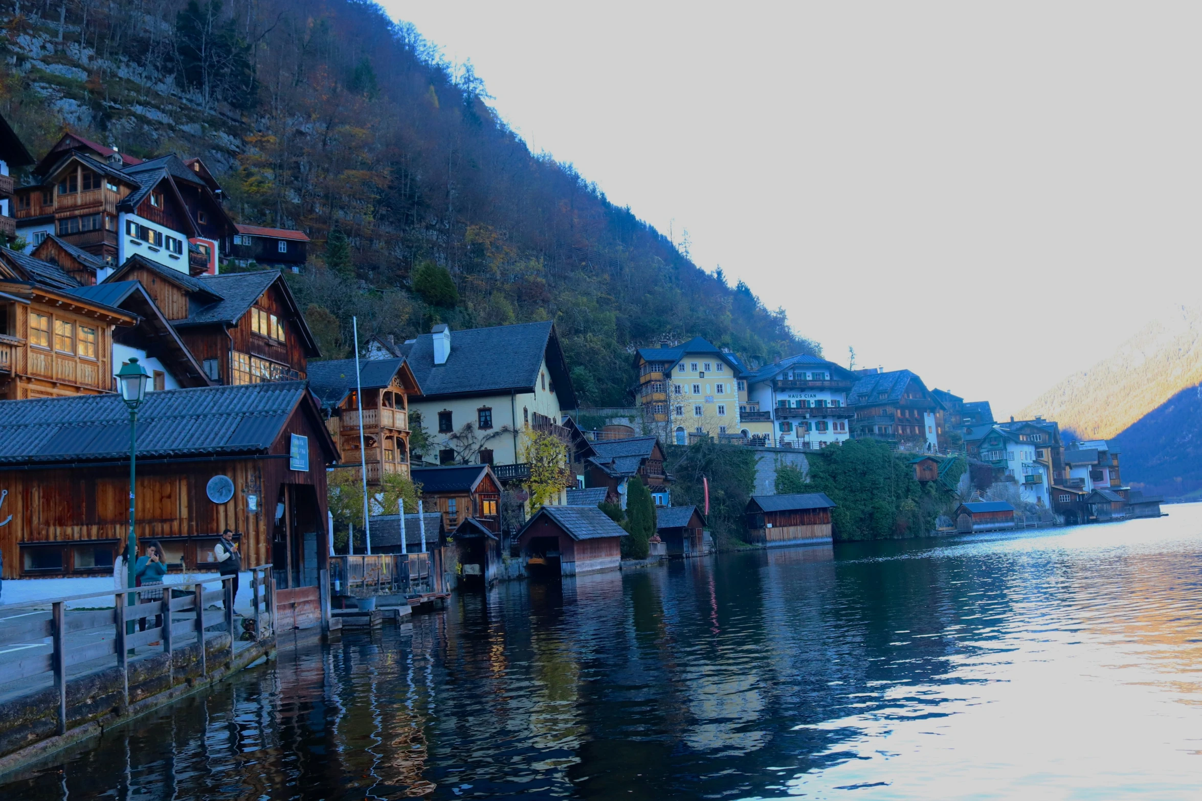 many houses on the shore near the mountains