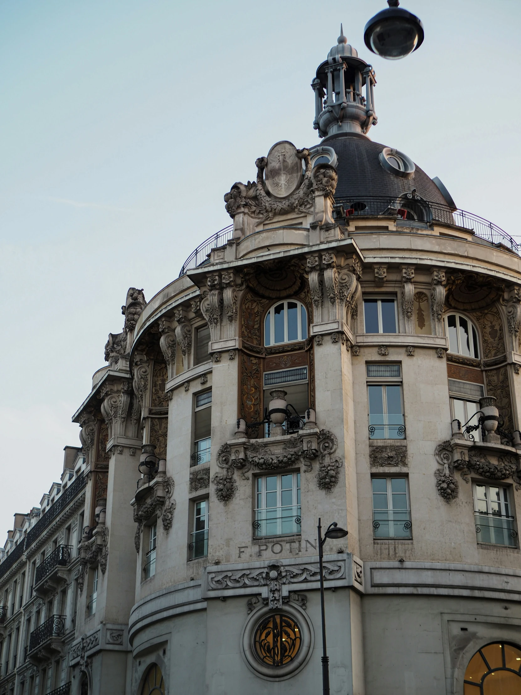 an ornate building that is beige with lots of windows