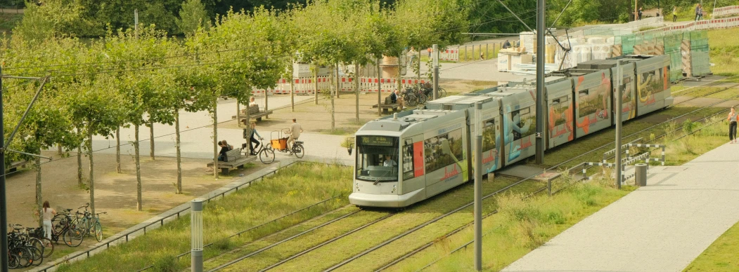 a passenger train travels down some train tracks