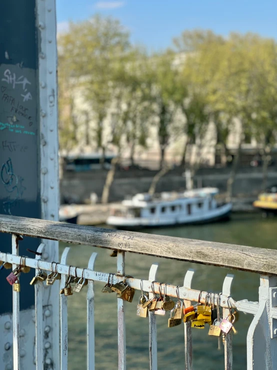 a bridge is covered in locks of locks on it's railing