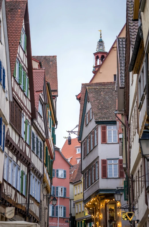 a group of buildings with open windows on the top of them