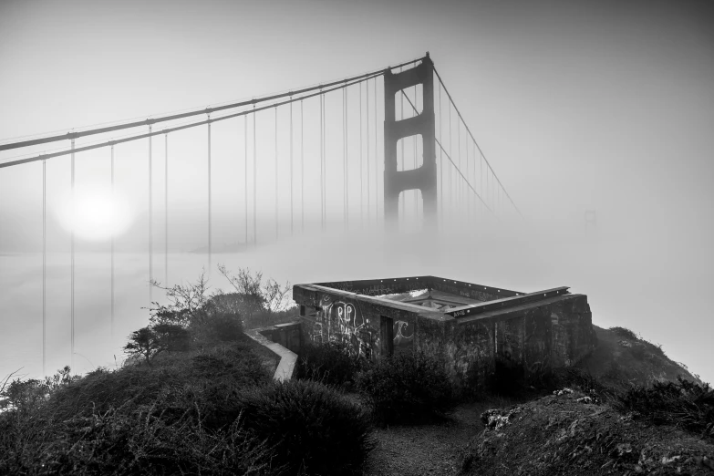 the golden gate bridge is covered in fog