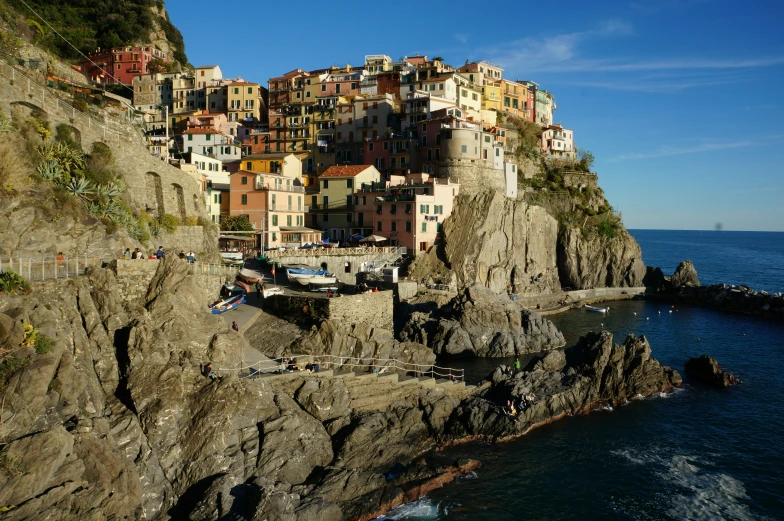 a cliff face with many buildings on it