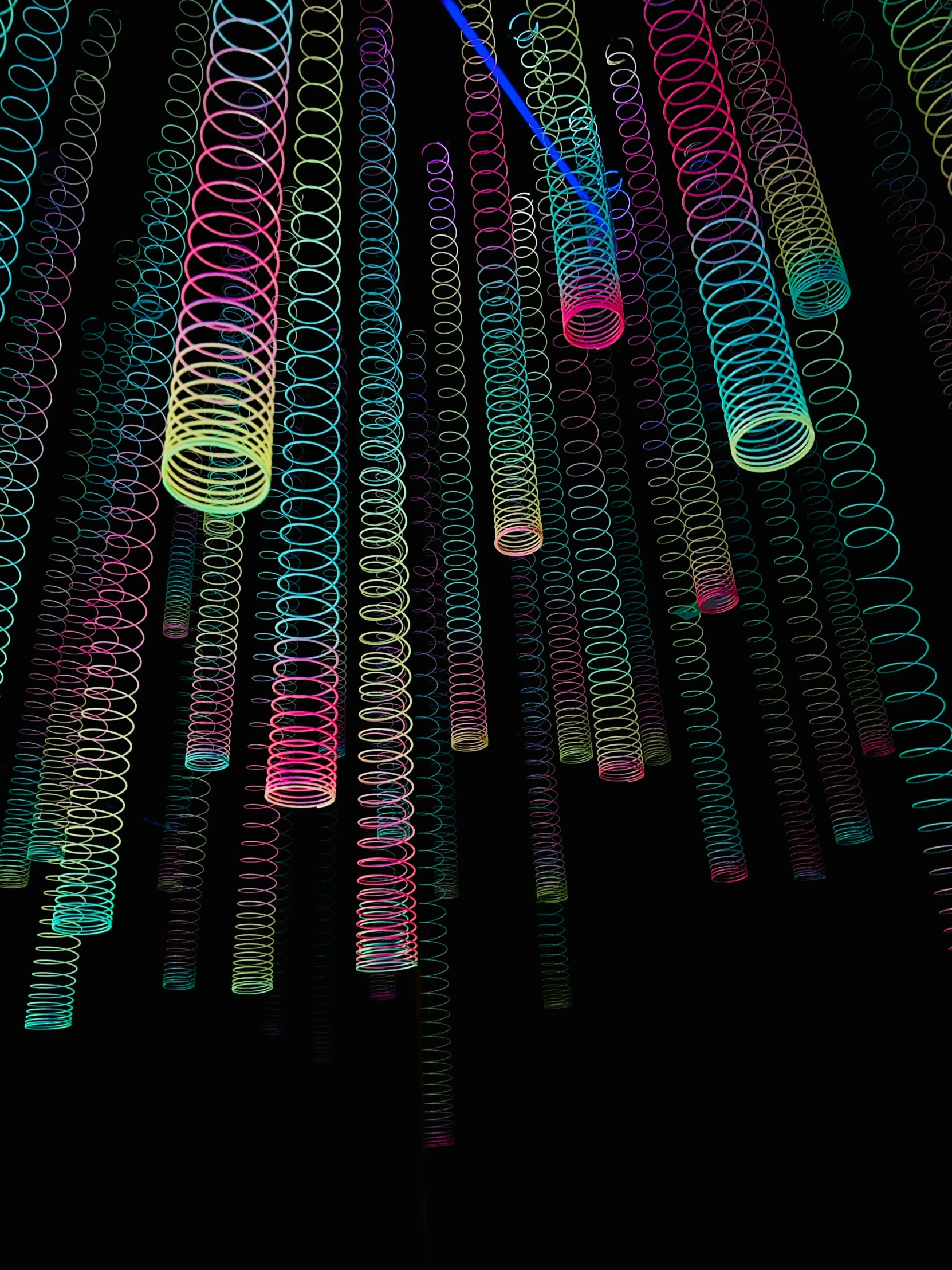 a group of neon tubes with numbers on them