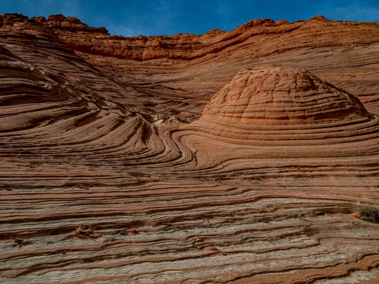 large lines in the sand making for unusual rock formations