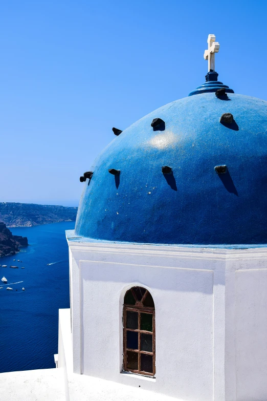 a blue dome and a water view from the city wall