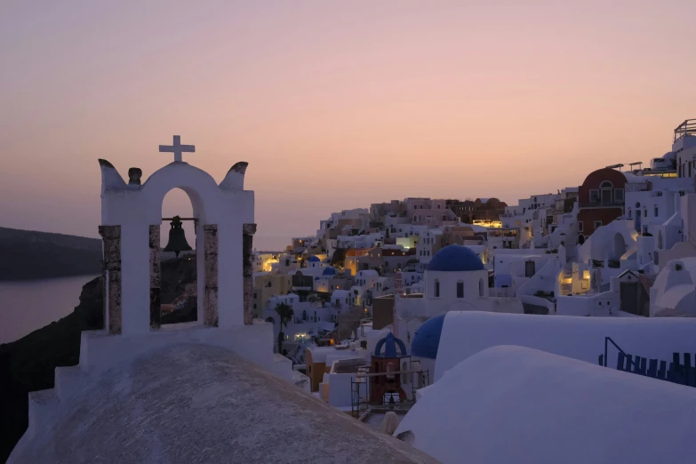 the white city with its unique architecture was illuminated by sunset