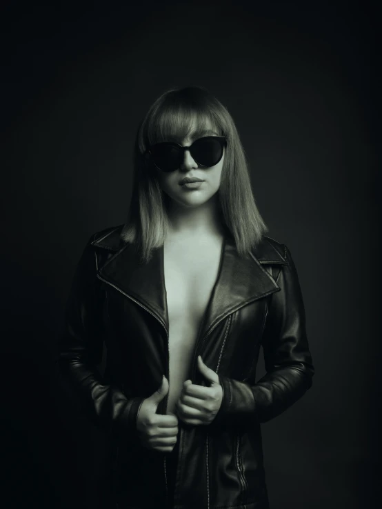 black and white pograph of a woman wearing sunglasses