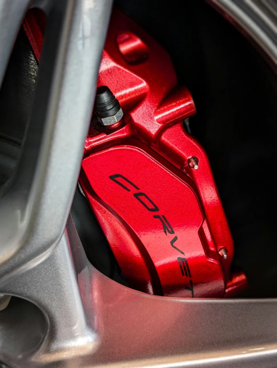 a red ke pad on the rear wheel of a car