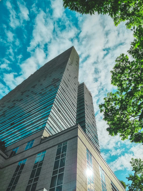 the front and side of a building against a sky background