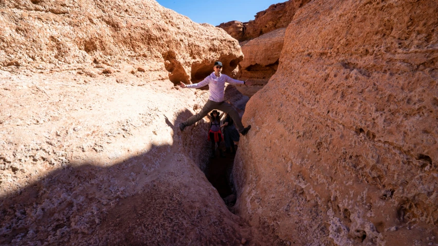 a man riding on the back of a brown horse