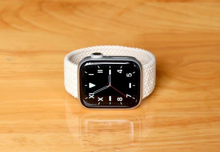 a closeup of an apple watch on a wooden table