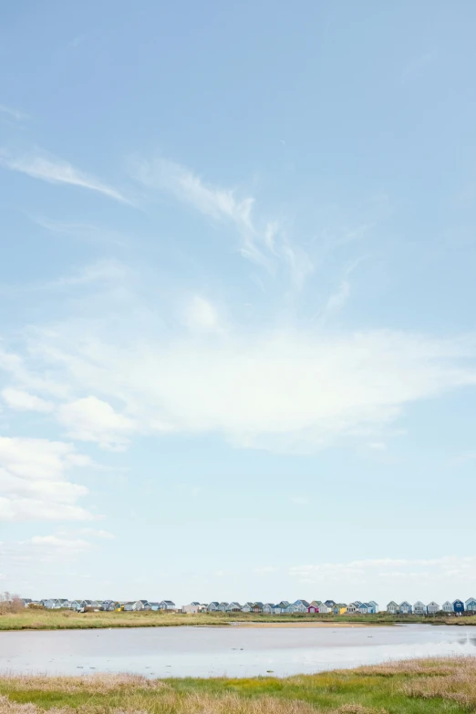 large airplane in an open field above the water