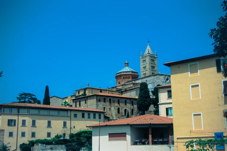 a picture with some buildings and a clock tower