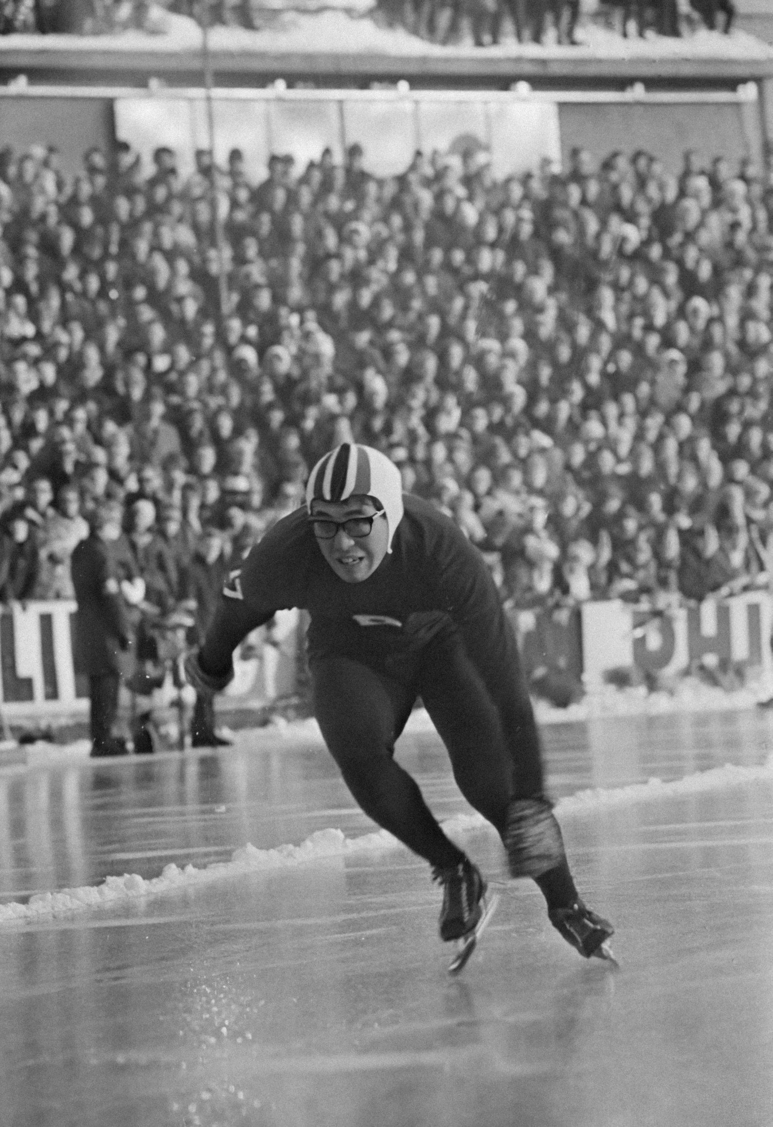 this is a po of a vintage po of a man in a football uniform running to the end of a track