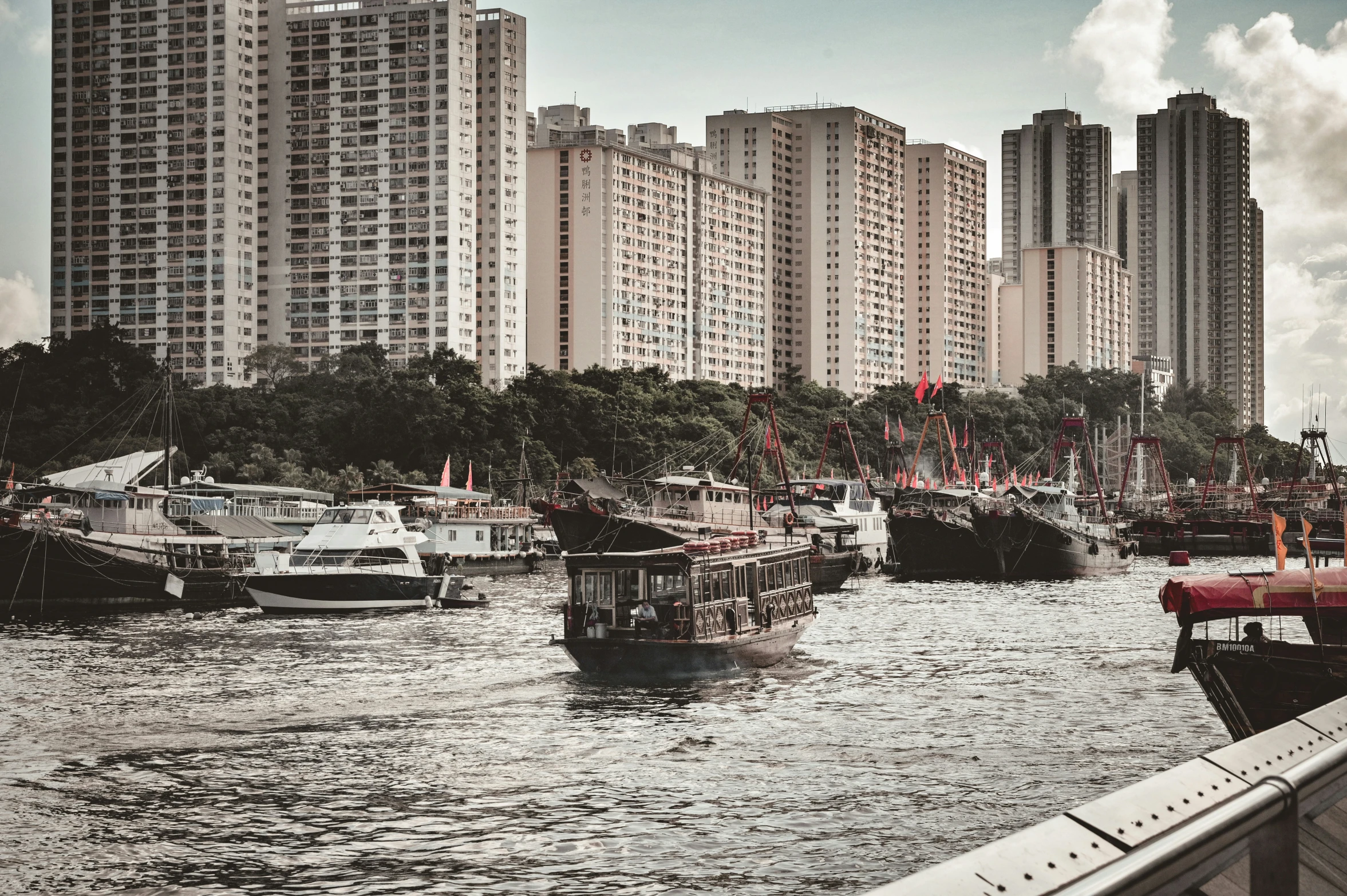 the boats are in the large river and many buildings