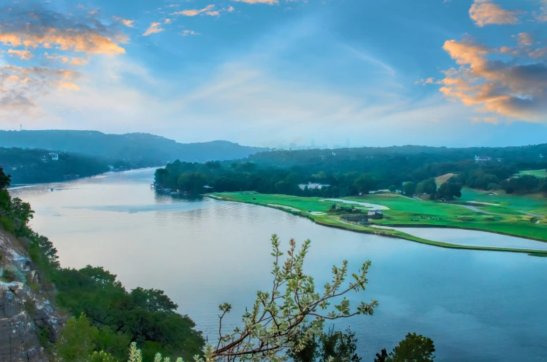 the view over a large body of water near a mountain