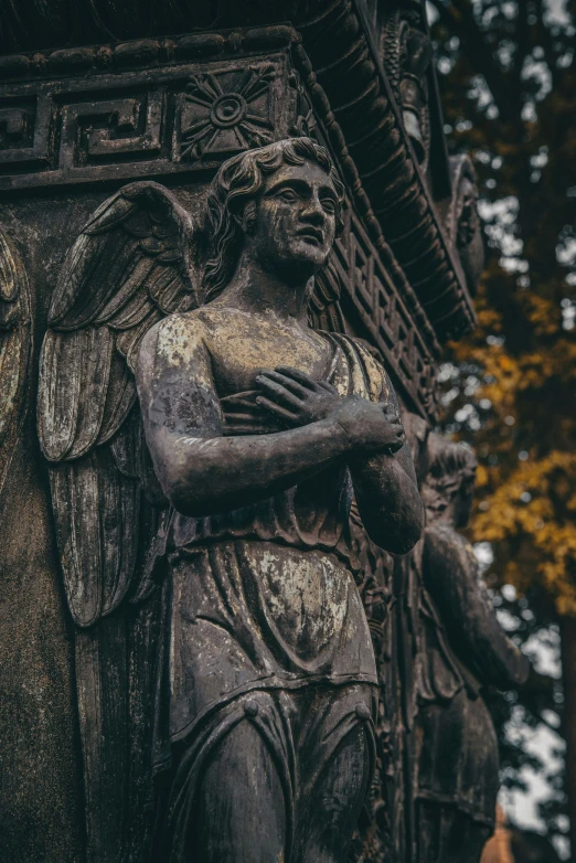 an image of a statue that looks like a praying man