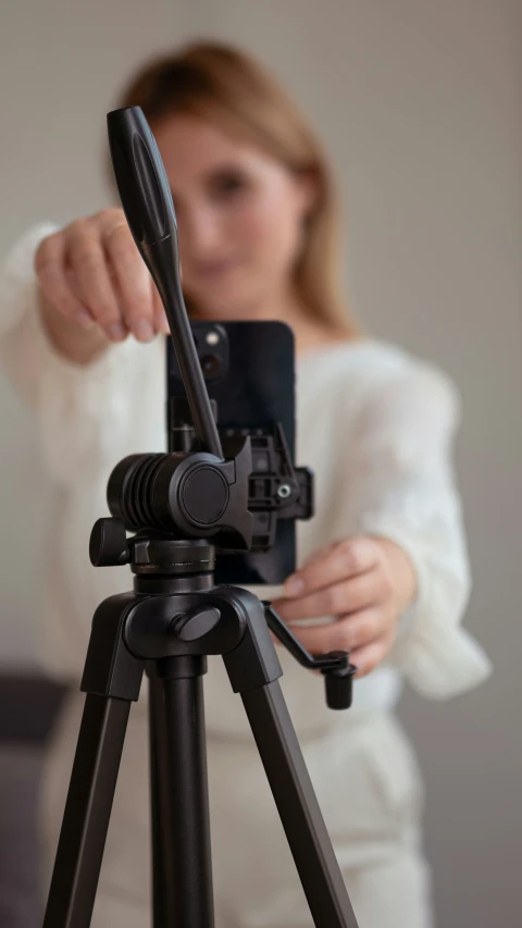 a girl taking a po on her tripod