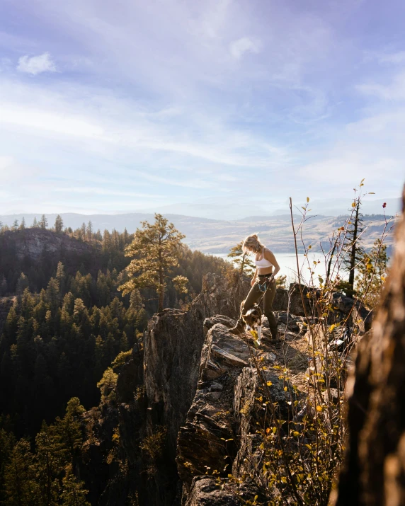 the man stands on top of a cliff