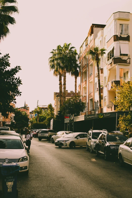 a couple of cars sitting in front of some buildings