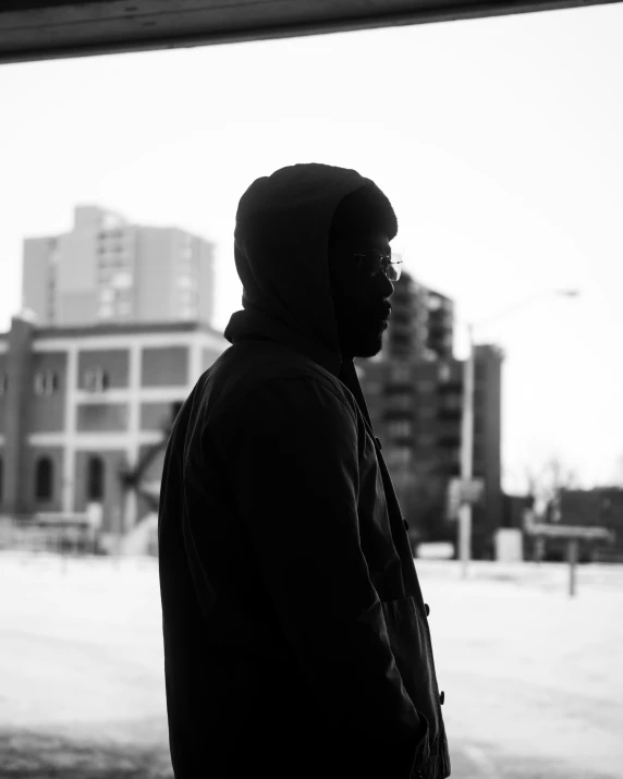 a man standing outside on a cold winter day