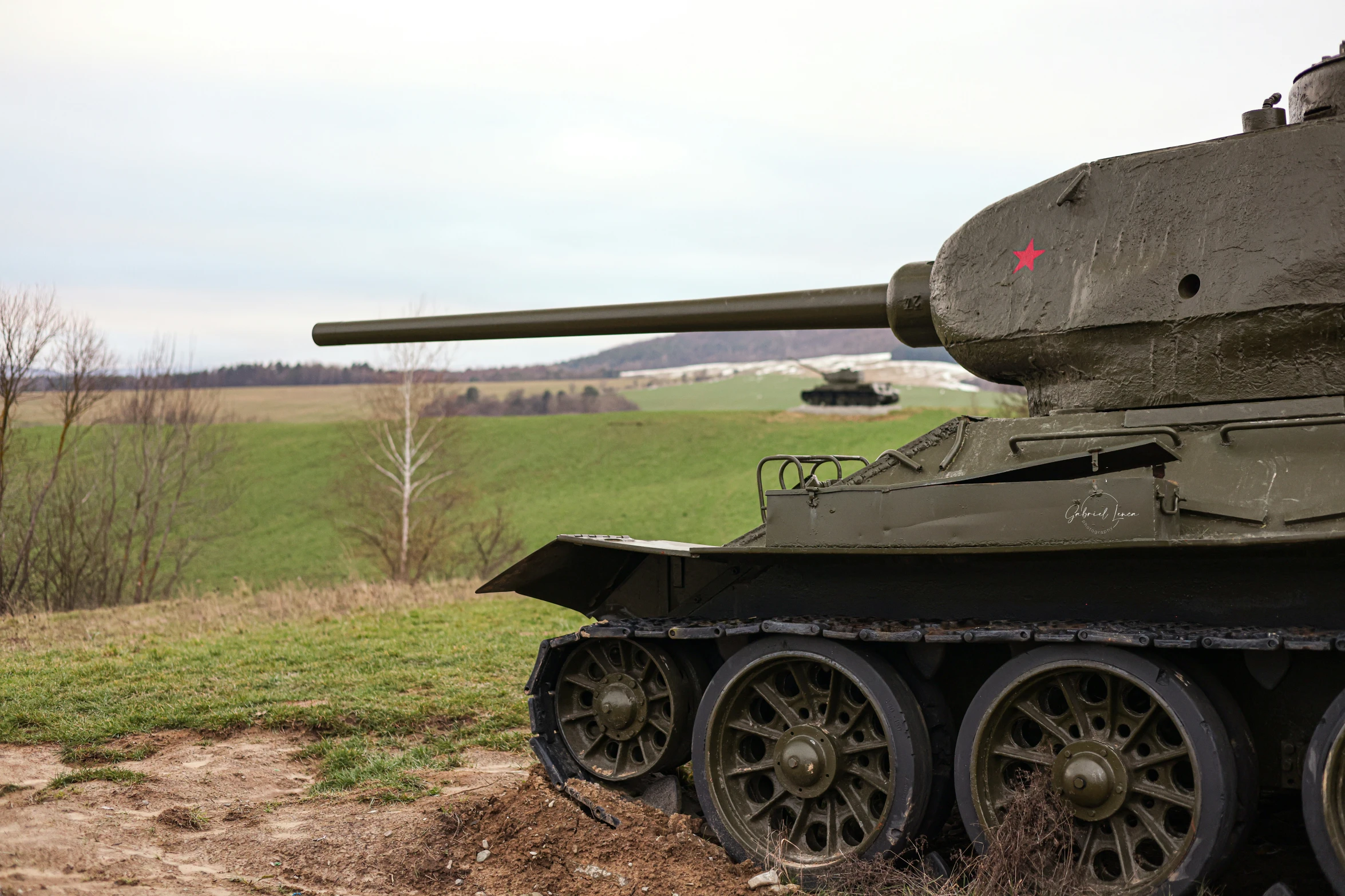 a close up of an old tank on the ground