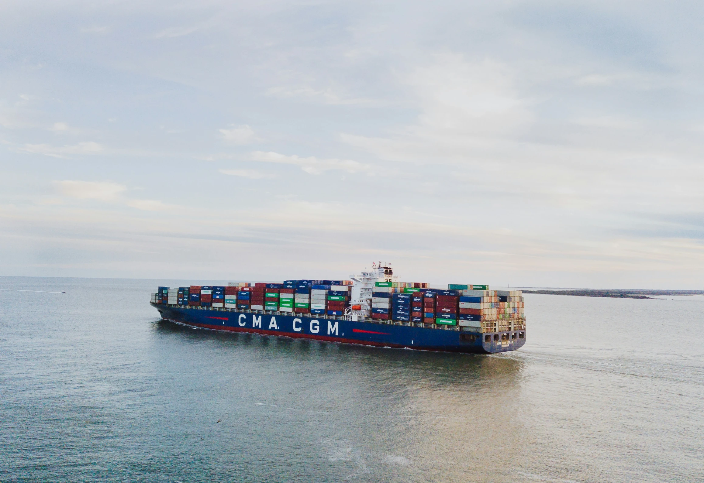 a large cargo ship in the middle of a body of water