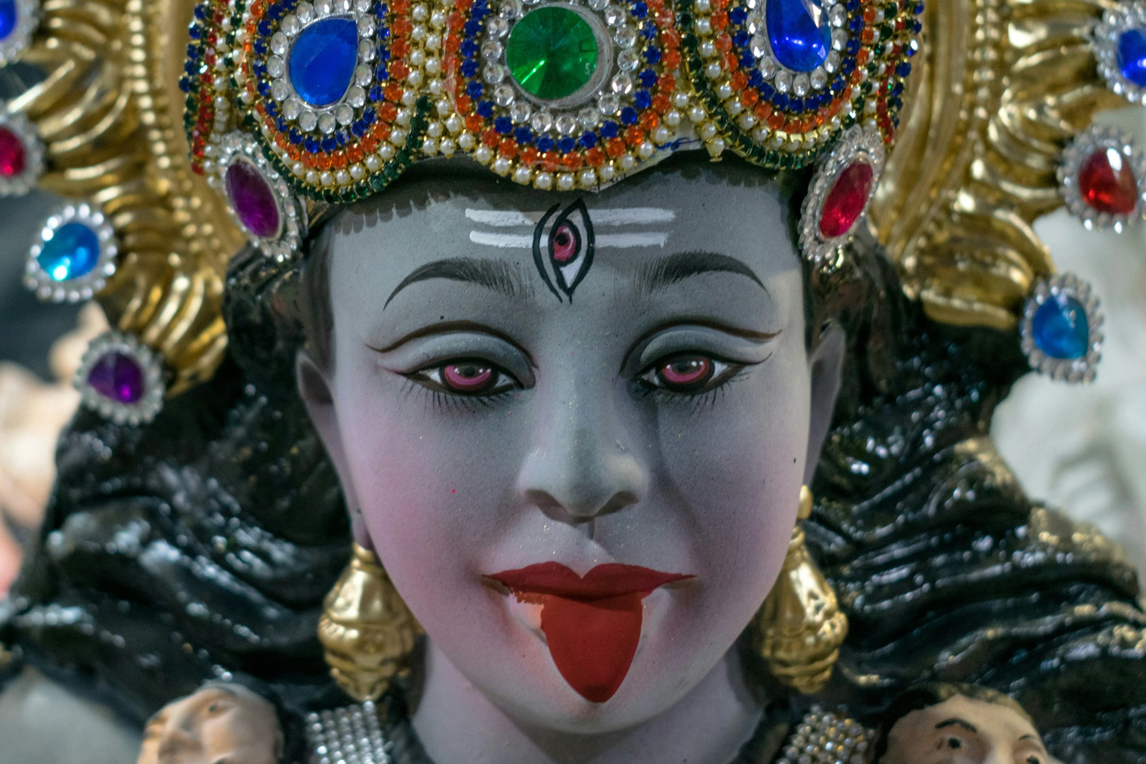 close up of a headdress with jewels on it