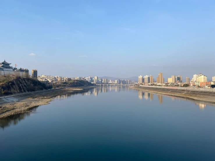 a large body of water surrounded by tall buildings