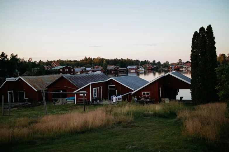 the red barn has a porch next to it