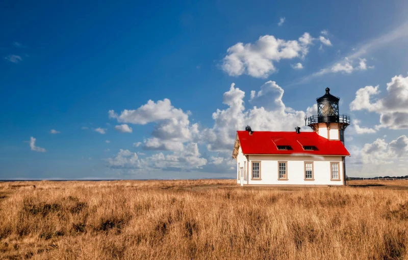 the large building with red roof is on the prairie