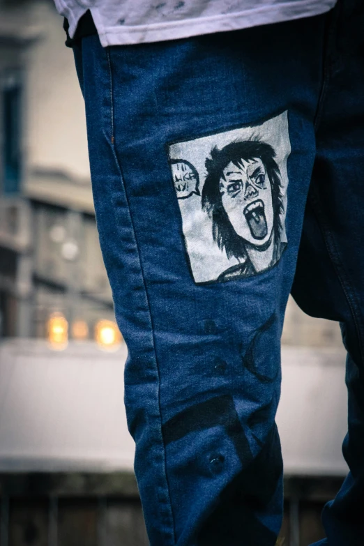 the face of a clown painted on a pair of jeans