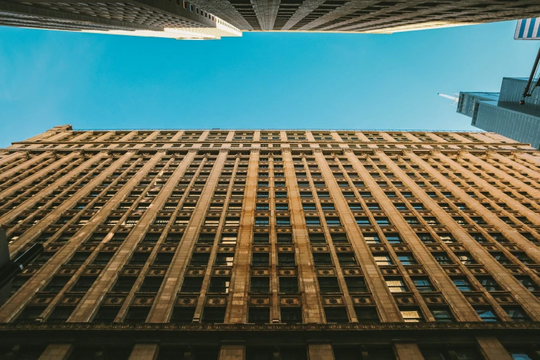 high rise office buildings against a blue sky