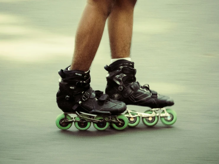 the legs of a person with boots on skateboards