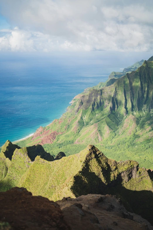 a view of the ocean from atop some cliffs