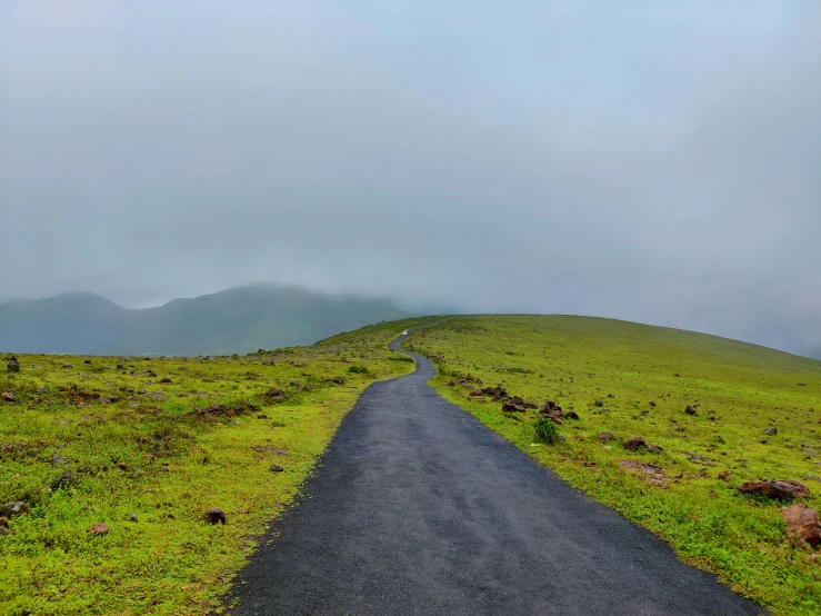 a road is going uphill on the side of a mountain