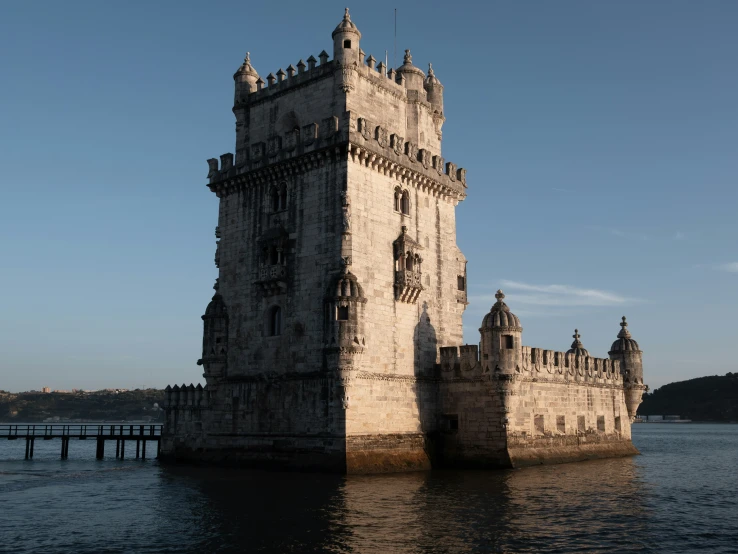 an old, castle like structure sitting on the water