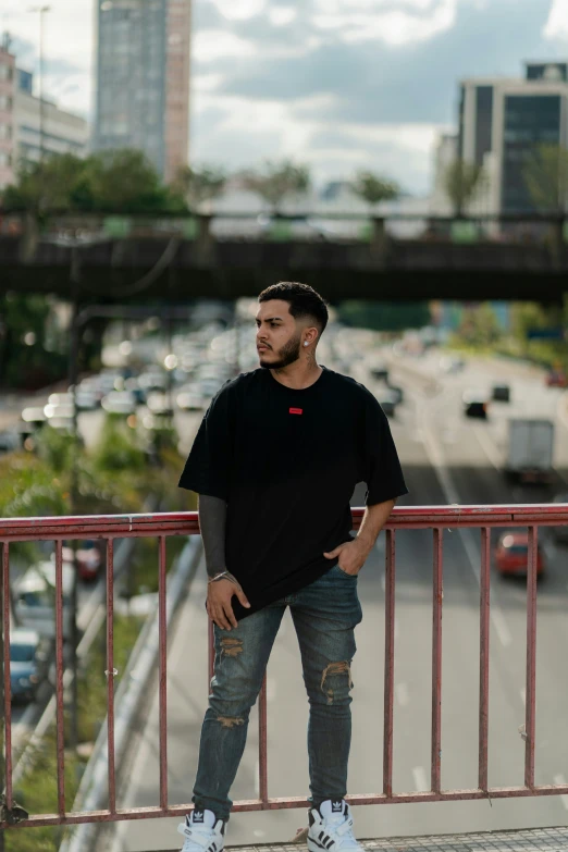 a man posing in front of a city street