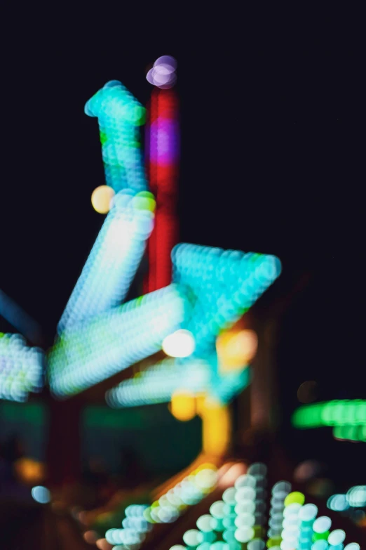 a carnival ride at night has colorful lights