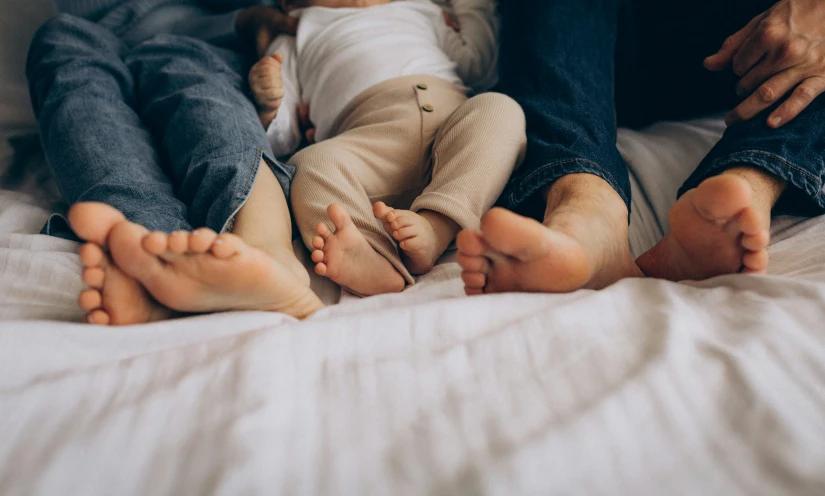 the two people with their feet up are holding each other's hands