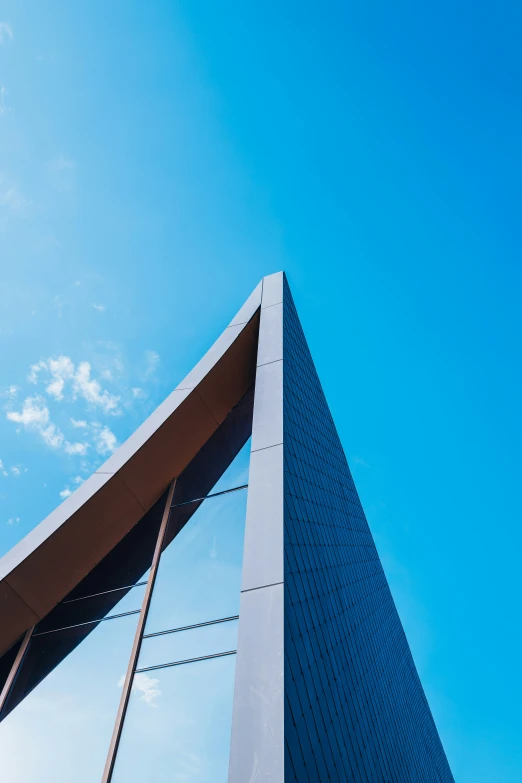 the outside of a tall metal structure against a blue sky