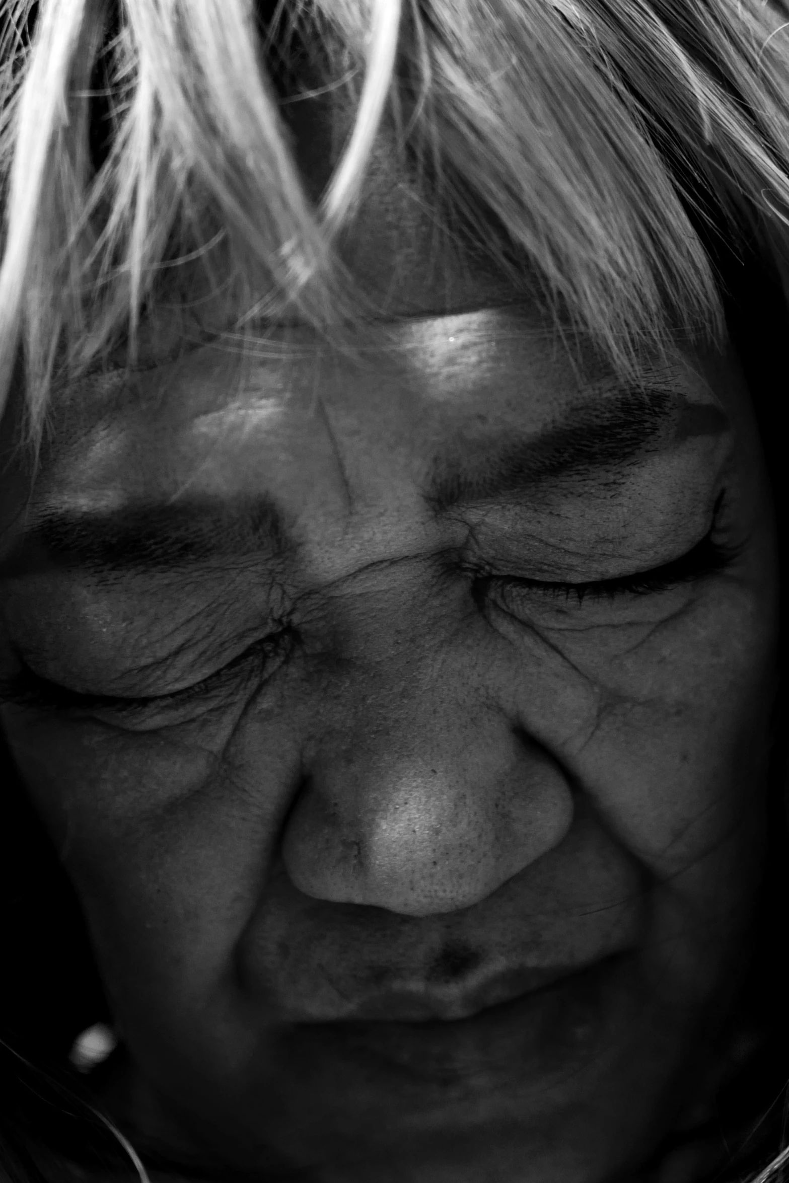 black and white po of a young woman with hair looking down