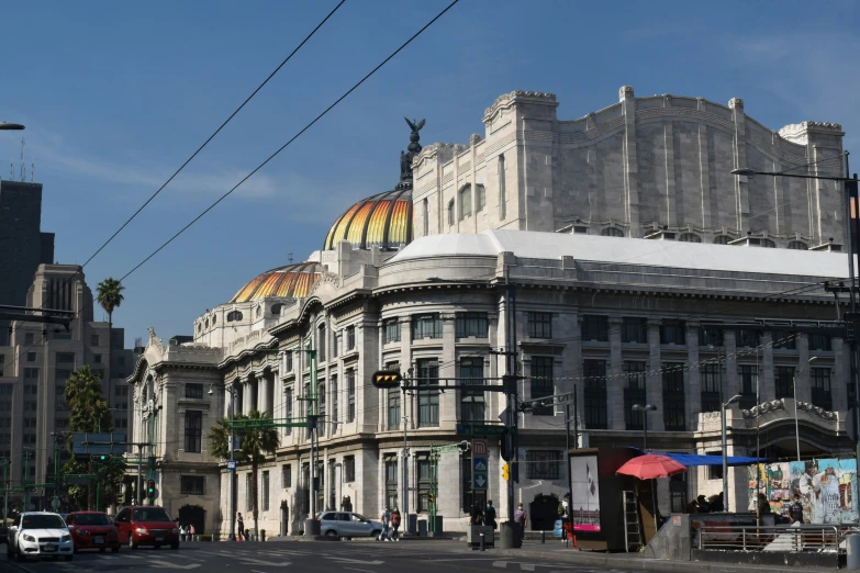 a building with three domes is situated on the corner