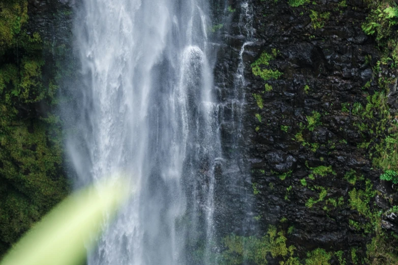 a waterfall with some water pouring out of it