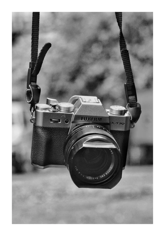 a black and white pograph of a camera