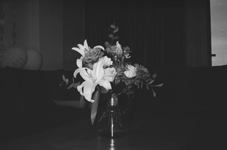 there is some flowers in the vase on a table