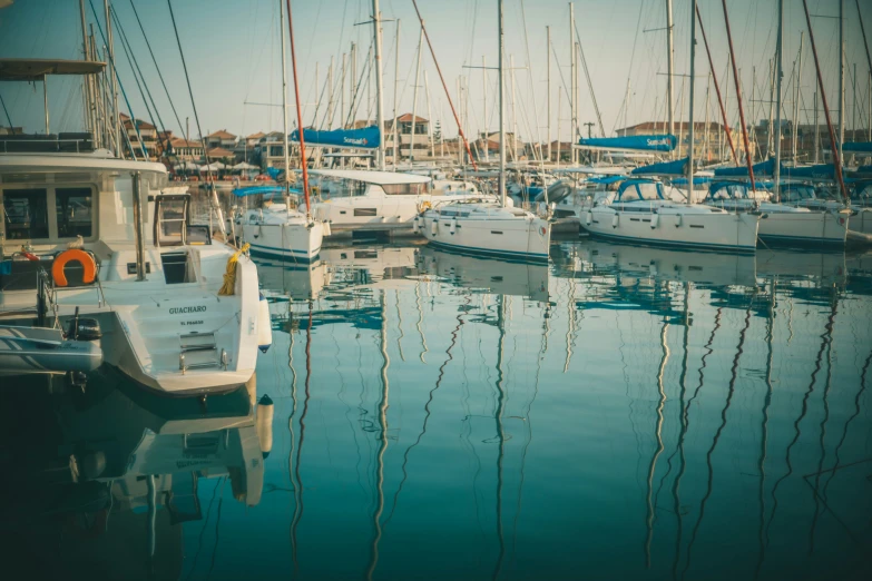 a boat marina with boats all moored and docked